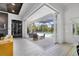 Living area featuring access to pool with wine display and modern ceiling at 16419 Kendleshire Ter, Lakewood Ranch, FL 34202