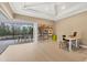 Bright office with a tray ceiling, shelving, and access to an outdoor space at 16419 Kendleshire Ter, Lakewood Ranch, FL 34202