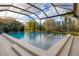 A beautiful pool and patio are enclosed by a screen at 16419 Kendleshire Ter, Lakewood Ranch, FL 34202