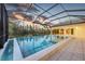 The pool and patio area are enclosed by a screened cage at 16419 Kendleshire Ter, Lakewood Ranch, FL 34202