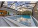The pool and patio area are enclosed by a large screened cage at 16419 Kendleshire Ter, Lakewood Ranch, FL 34202
