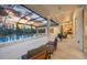 A screened-in pool area offers outdoor dining and lounging with views of the yard at 16419 Kendleshire Ter, Lakewood Ranch, FL 34202