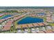 Aerial view of a neighborhood showcasing homes, ponds, and green spaces at 17216 Star Banks St, Wimauma, FL 33598