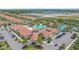 A beautiful aerial view of the community clubhouse, pool, and tennis courts in a landscaped setting at 17216 Star Banks St, Wimauma, FL 33598