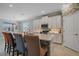 Modern kitchen with an island, white cabinets, stainless steel appliances and tile backsplash at 17216 Star Banks St, Wimauma, FL 33598