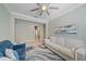 Cozy living room features a sofa, chair, rug, and a painting of the sky at 17216 Star Banks St, Wimauma, FL 33598