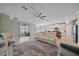 Spacious living room with sliding glass doors leading to the backyard and open to the kitchen at 17216 Star Banks St, Wimauma, FL 33598
