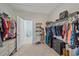 Large walk-in closet featuring clothing racks, shelving, and drawers for ample storage at 17216 Star Banks St, Wimauma, FL 33598