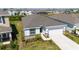 Well-maintained single-story home featuring a two-car garage, tidy lawn, and manicured landscaping at 17715 Cantarina Cv, Bradenton, FL 34211