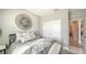 Comfortable bedroom with double closet featuring plush bedding and stylish decor at 17715 Cantarina Cv, Bradenton, FL 34211