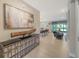 Inviting foyer with stylish console table and open view into living spaces at 17715 Cantarina Cv, Bradenton, FL 34211
