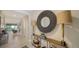 Elegant foyer featuring decorative mirror and lamps on a wooden console table at 17715 Cantarina Cv, Bradenton, FL 34211