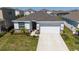 Charming single-story home featuring a two car garage and landscaped front yard at 17715 Cantarina Cv, Bradenton, FL 34211