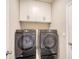 Convenient laundry room featuring new, front-loading Samsung washer and dryer at 17715 Cantarina Cv, Bradenton, FL 34211