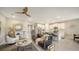 Open-concept living area with a comfortable leather sofa, leading into the modern kitchen at 17715 Cantarina Cv, Bradenton, FL 34211