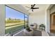 Relax on the screened lanai, featuring comfortable seating and a view of the community at 17715 Cantarina Cv, Bradenton, FL 34211