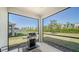 Enjoy outdoor dining with the BBQ grill and screened lanai overlooking the landscaped backyard at 17715 Cantarina Cv, Bradenton, FL 34211