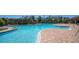 Bright, inviting community pool surrounded by lush landscaping at 17715 Cantarina Cv, Bradenton, FL 34211