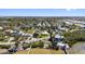 Waterfront neighborhood with a mix of homes nestled among lush trees and docks at 1815 Palma Sola Blvd, Bradenton, FL 34209