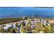 Aerial view of waterfront homes near bay with boat dock at 1815 Palma Sola Blvd, Bradenton, FL 34209