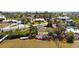 Aerial view highlighting bayfront property with mature landscaping and direct bay access at 1815 Palma Sola Blvd, Bradenton, FL 34209