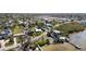 Waterfront homes nestled among lush trees, with access to the bay and private docks at 1815 Palma Sola Blvd, Bradenton, FL 34209