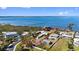 Aerial view of waterfront property outlined in red showing proximity to the bay and other homes at 1815 Palma Sola Blvd, Bradenton, FL 34209