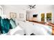 Bright main bedroom features hardwood floors, ensuite bath, and walk-in closet at 1904 Hyde Park St, Sarasota, FL 34239