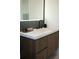 Bathroom vanity with gray marble accent wall, modern sink, and black fixtures at 212 S Renellie Dr, Tampa, FL 33609