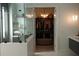 Elegant bathroom connecting to walk-in closet with pendant lighting and an ottoman at 212 S Renellie Dr, Tampa, FL 33609