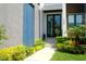 A welcoming entrance with tiled entryway, stone steps and garden area at 212 S Renellie Dr, Tampa, FL 33609