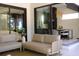 Cozy covered patio with modern furniture and an open view into the dining area at 212 S Renellie Dr, Tampa, FL 33609