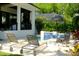 Backyard oasis with pool, lounge chairs, lush greenery, and tranquil seating area at 212 S Renellie Dr, Tampa, FL 33609