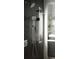 Luxurious glass shower with dual showerheads, shelves, and stylish fixtures at 212 S Renellie Dr, Tampa, FL 33609