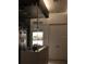 Contemporary glass enclosed shower, with shelving, and double doors to the Primary at 212 S Renellie Dr, Tampa, FL 33609