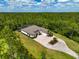 A stunning aerial view of a home with lush landscaping at 22209 Deer Pointe Xing, Bradenton, FL 34202