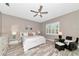 Inviting bedroom with light gray walls and a ceiling fan at 22209 Deer Pointe Xing, Bradenton, FL 34202