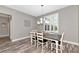 Dining room with modern chandelier, shuttered windows, and gray walls at 22209 Deer Pointe Xing, Bradenton, FL 34202