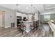 Open-concept kitchen with stainless steel appliances, counter seating, and breakfast nook at 22209 Deer Pointe Xing, Bradenton, FL 34202