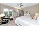 Spacious main bedroom featuring ample natural light, slider to lanai, and neutral tones at 22209 Deer Pointe Xing, Bradenton, FL 34202
