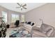 Bright home office with shuttered windows, ceiling fan, and comfortable seating at 22209 Deer Pointe Xing, Bradenton, FL 34202