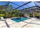 Relaxing screened-in pool and spa with lush landscaping, and cabana at 22209 Deer Pointe Xing, Bradenton, FL 34202