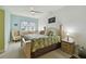 Bright main bedroom featuring a ceiling fan, desk near the window, and coordinated furnishings at 2715 Terra Ceia Bay Blvd # 202, Palmetto, FL 34221