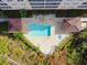 Aerial view of the community pool with a hot tub, covered lounge areas, and beautiful tile deck at 2715 Terra Ceia Bay Blvd # 202, Palmetto, FL 34221