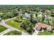 Aerial view of house with pool, gazebo, shed, and lush vegetation at 3514 Laslo Ave, North Port, FL 34287