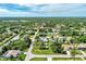 Aerial view of home showcasing an in-ground pool, gazebo, and storage shed in a landscaped yard at 3514 Laslo Ave, North Port, FL 34287