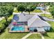 The aerial view shows a screened pool and well-maintained lawn offering a private backyard for relaxation at 3514 Laslo Ave, North Port, FL 34287