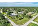Aerial view showcases backyard pool, gazebo, storage shed and large grass yard at 3514 Laslo Ave, North Port, FL 34287