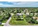 Aerial view of home features a backyard pool, storage shed, gazebo and lush landscaping at 3514 Laslo Ave, North Port, FL 34287