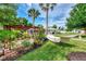 Spacious backyard featuring a hammock, wooden pergola, and lush greenery, perfect for relaxation at 3514 Laslo Ave, North Port, FL 34287